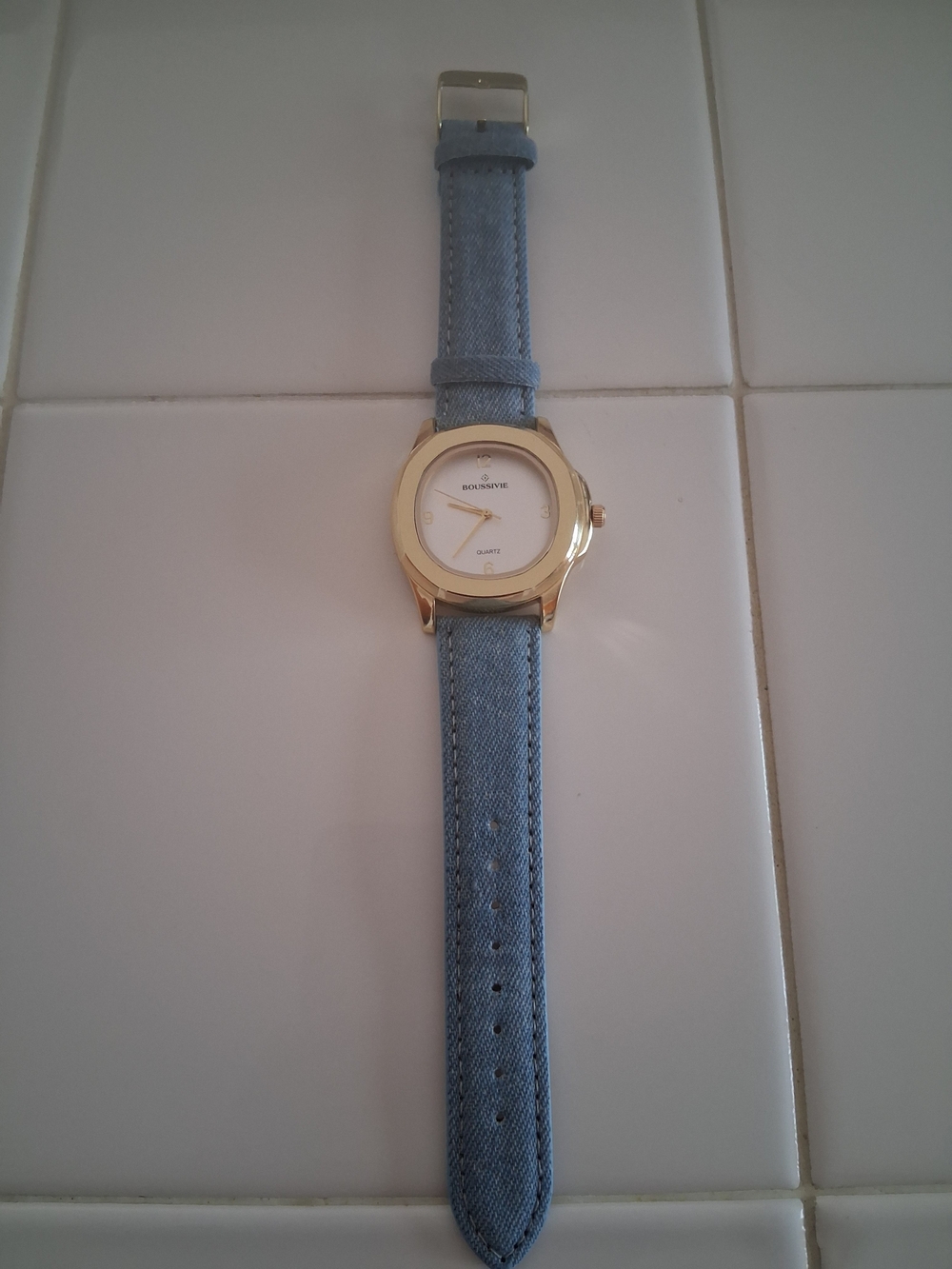 Gold-Tone Round Watch with Light Blue Fabric Strap